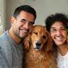 Walker family smiling with spaniel